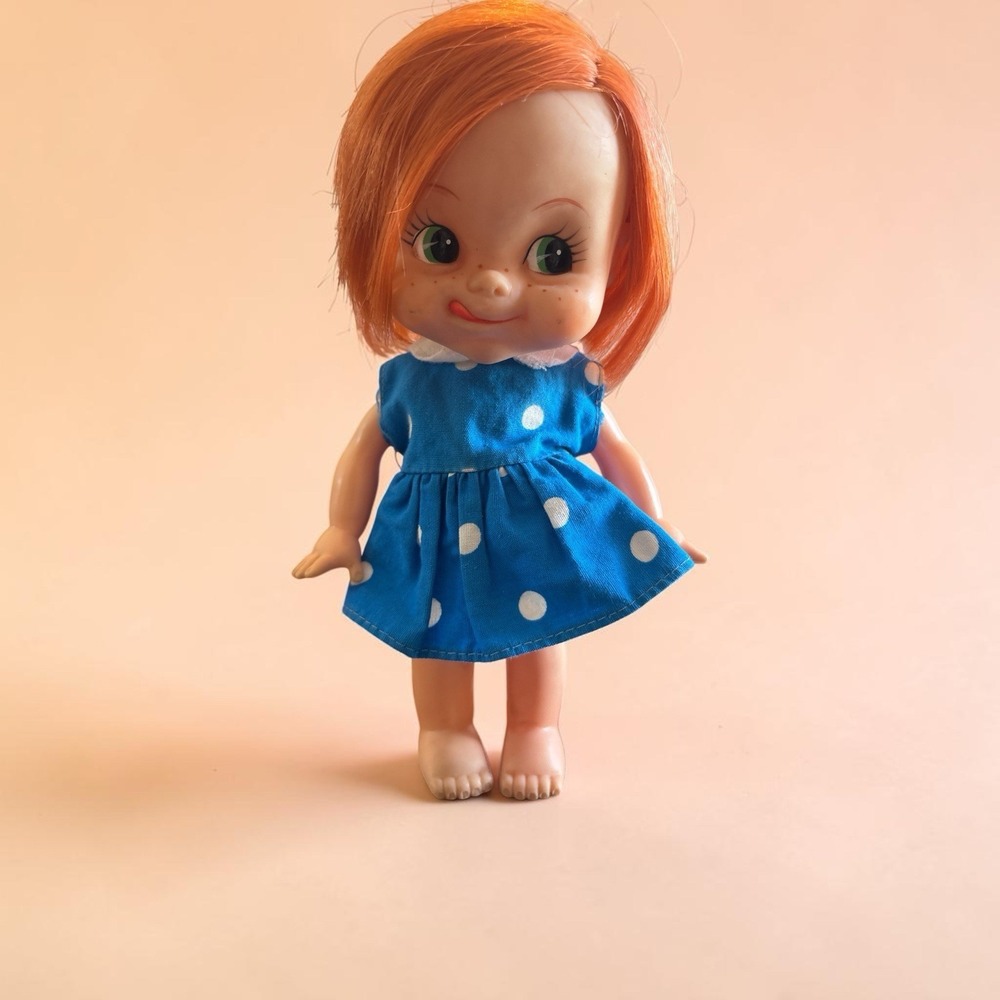 1960s Doll made in Japan red hair green eyes,tounge out,original dress